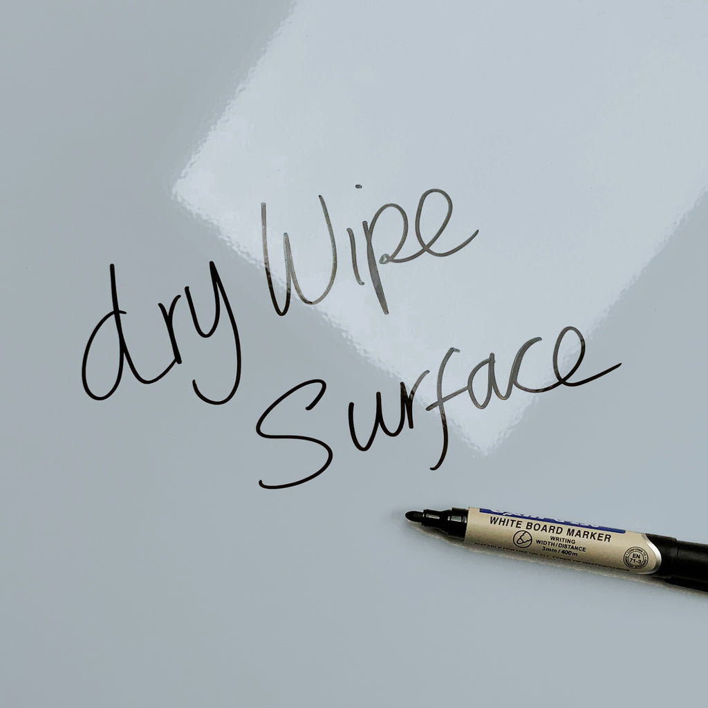 The words dry wipe surface written in marker pen on the Bicycle And Flower Basket magnetic notice board