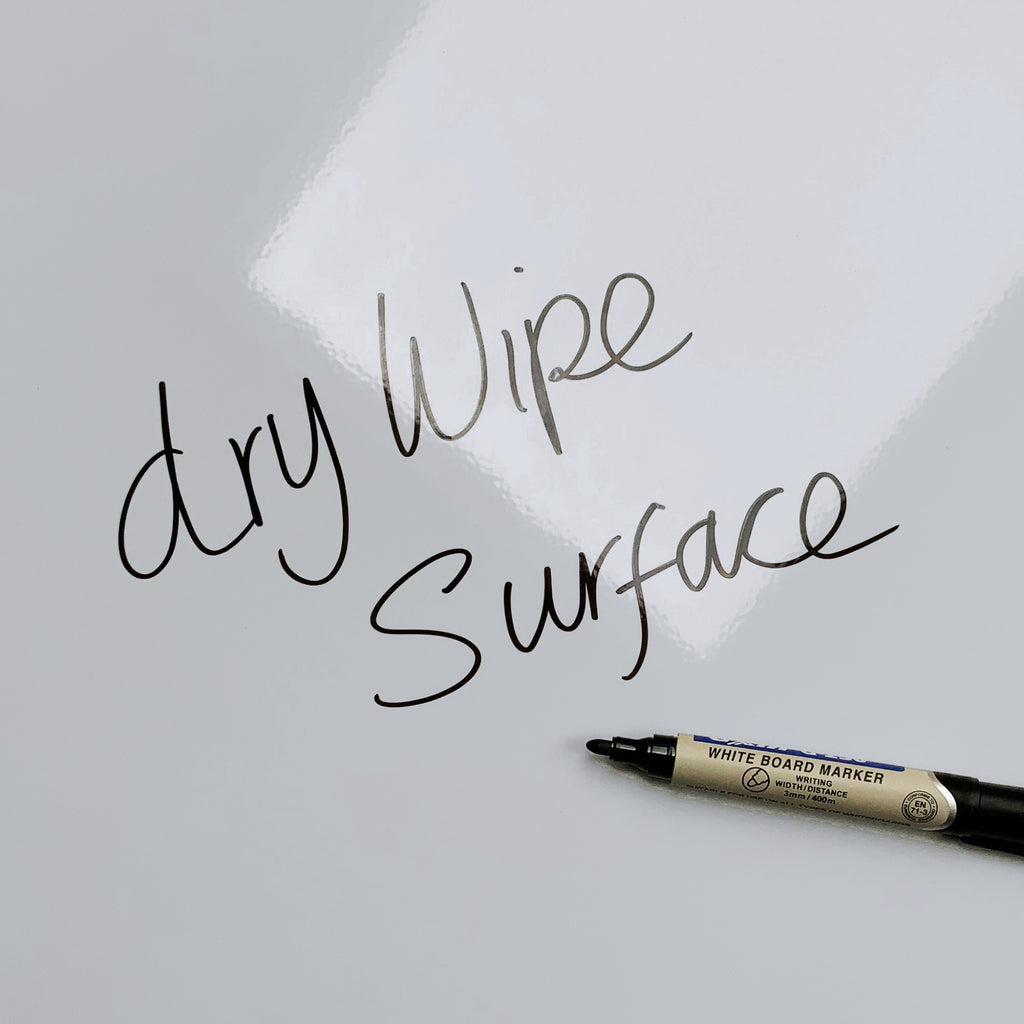 The words dry wipe surface written in marker pen on the Bicycle Spokes magnetic notice board