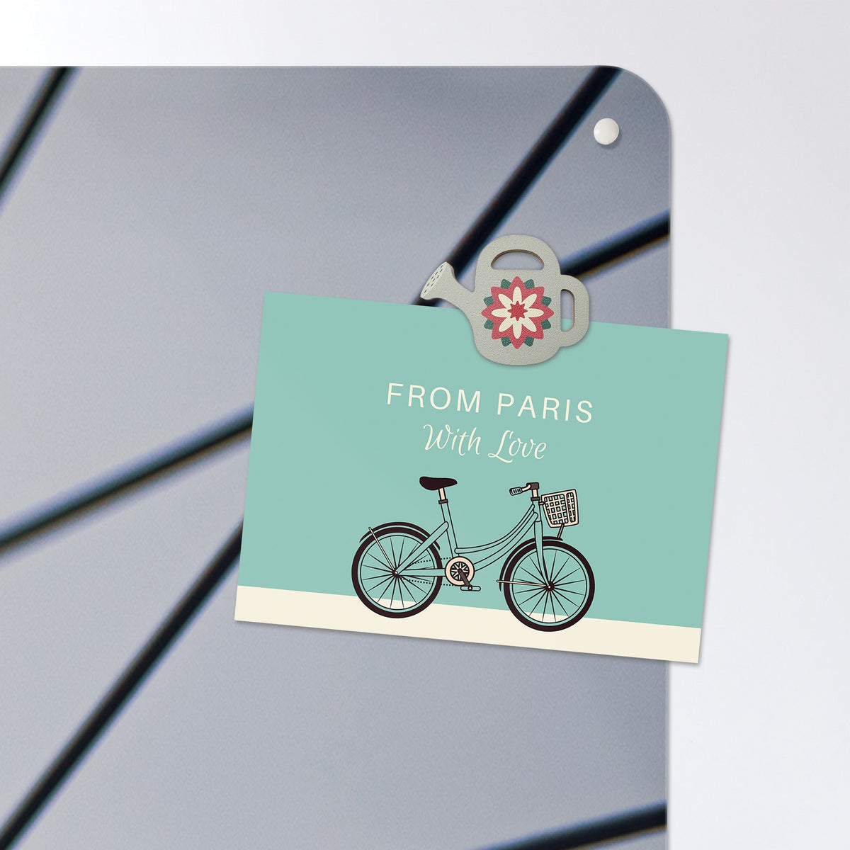 A postcard held by a fridge magnet on the Bicycle Spokes magnetic notice board