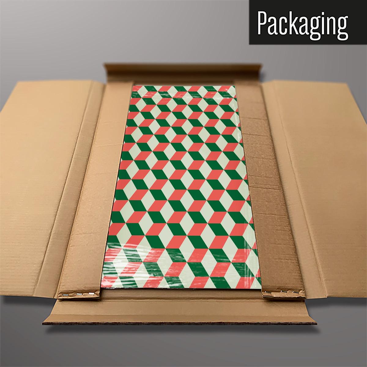 The Blocks Design magnetic notice board in Red Cream and Green packed flat in its cardboard box