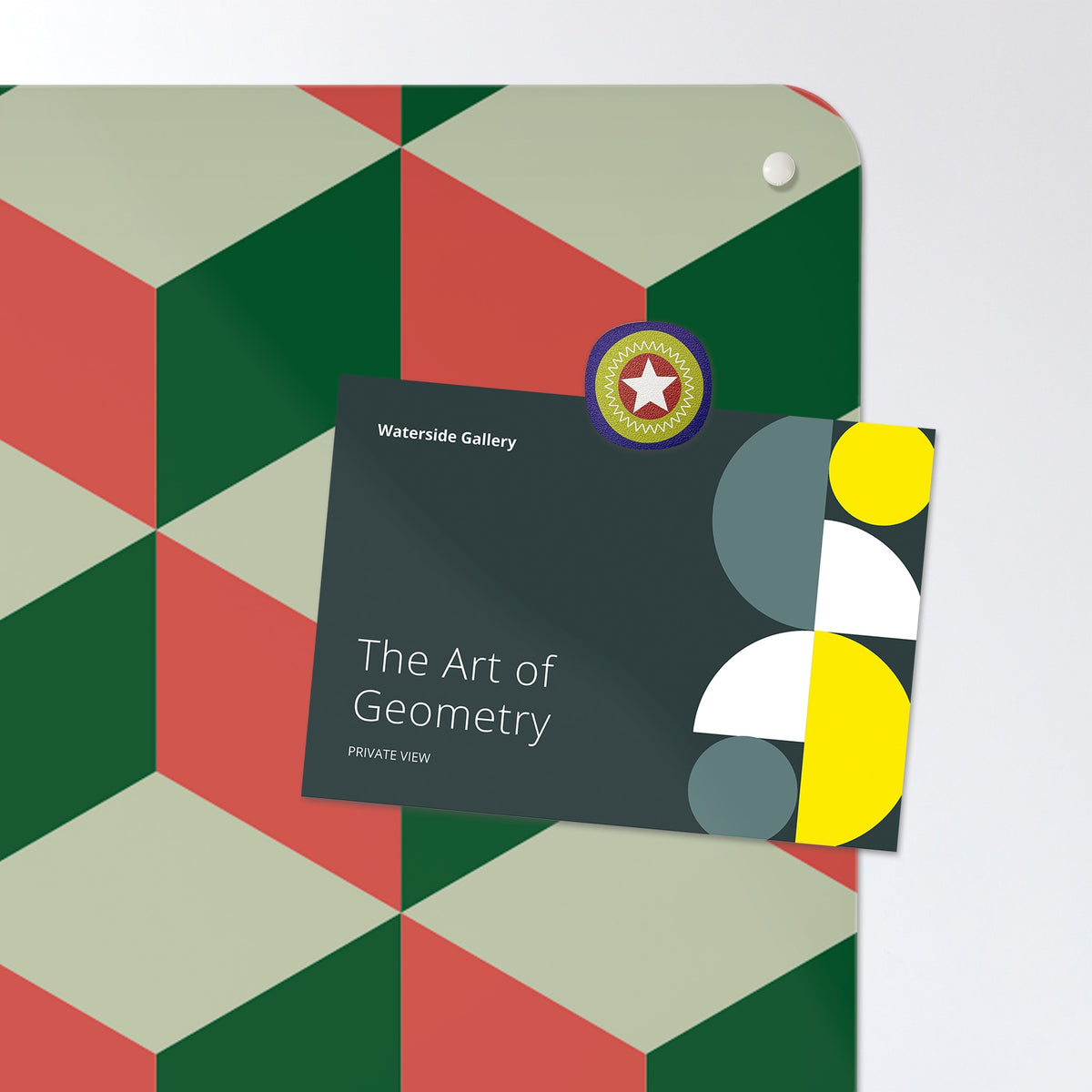 A postcard held by a fridge magnet on the Blocks Design magnetic notice board in Red Cream and Green