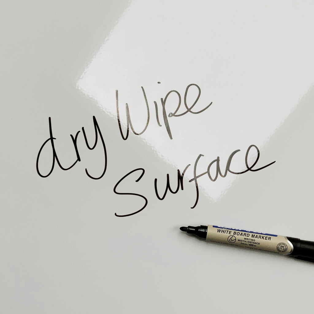 The words dry wipe surface written in marker pen on the Brutalist Balconies magnetic notice board