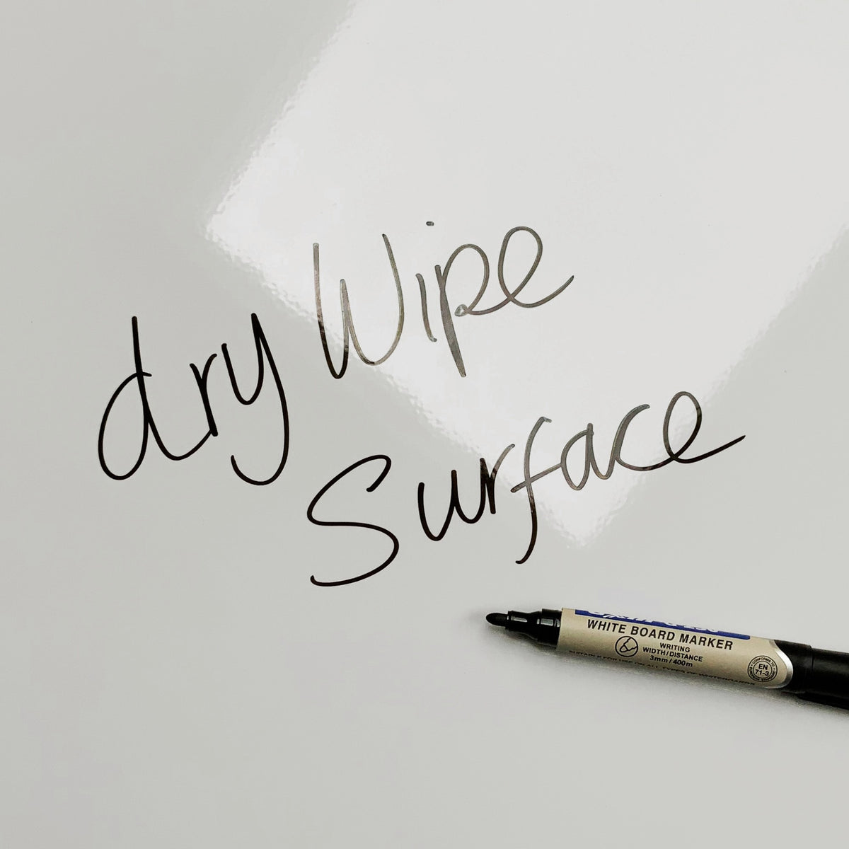 The words dry wipe surface written in marker pen on the Brutalist Balconies magnetic notice board