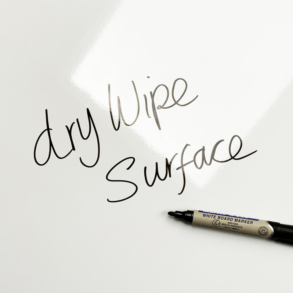The words dry wipe surface written in marker pen on the Bugs Earthy magnetic notice board