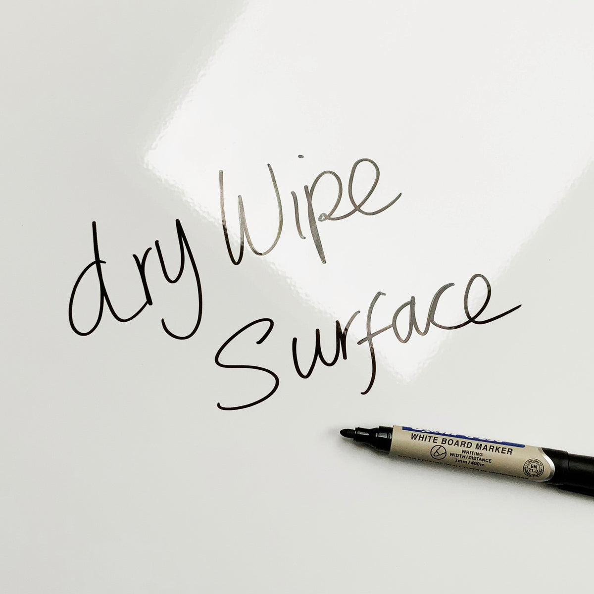 The words dry wipe surface written in marker pen on the Buttons Buttons magnetic notice board