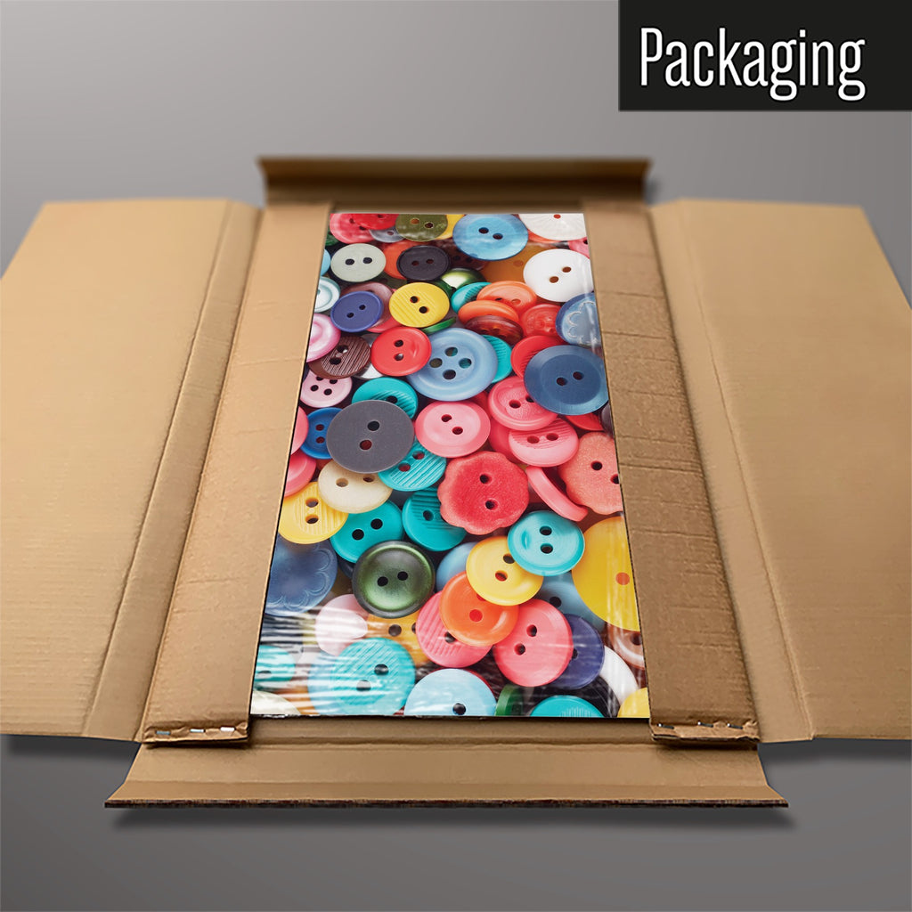 The Buttons magnetic notice board in Buttons packed flat in its cardboard box