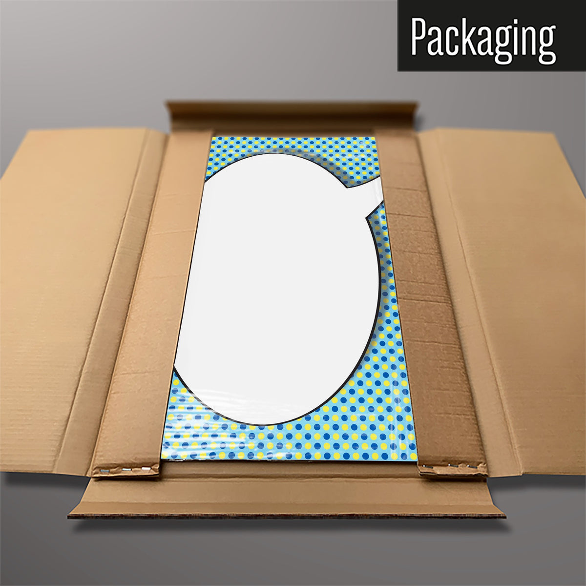 The Cartoon Bubble magnetic notice board in Speech Bubble - Blue/Yellow packed flat in its cardboard box