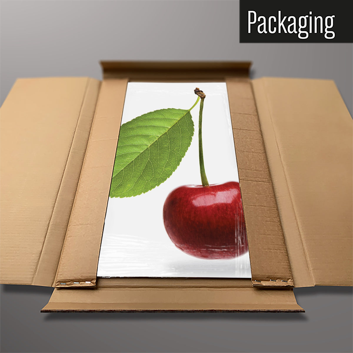 The Cherry magnetic notice board in Cherry packed flat in its cardboard box