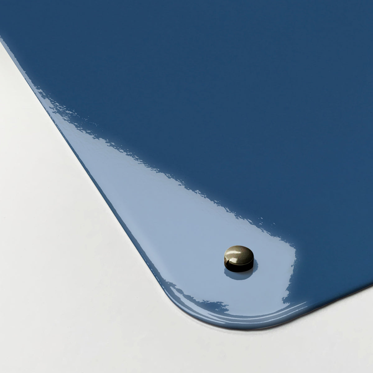 Close-up of the corner of the Cloud Heart magnetic notice board in Cloud Heart, showing the gloss finish and a screw cap