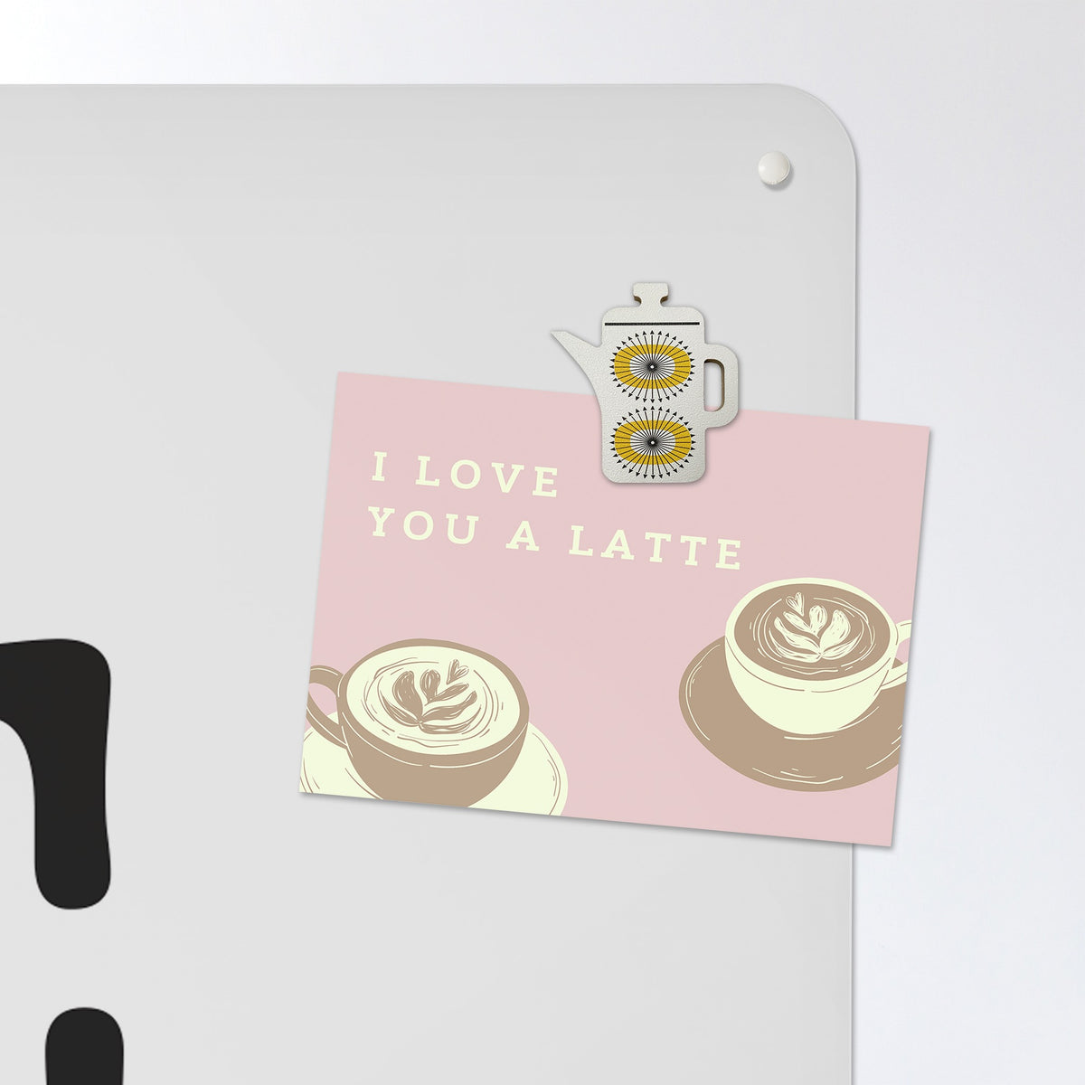 A postcard held by a fridge magnet on the Coffee Quote magnetic notice board