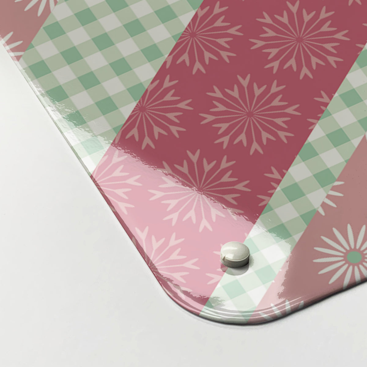 Close-up of the corner of the Cool Britannia magnetic notice board in Pink and Green, showing the gloss finish and a screw cap