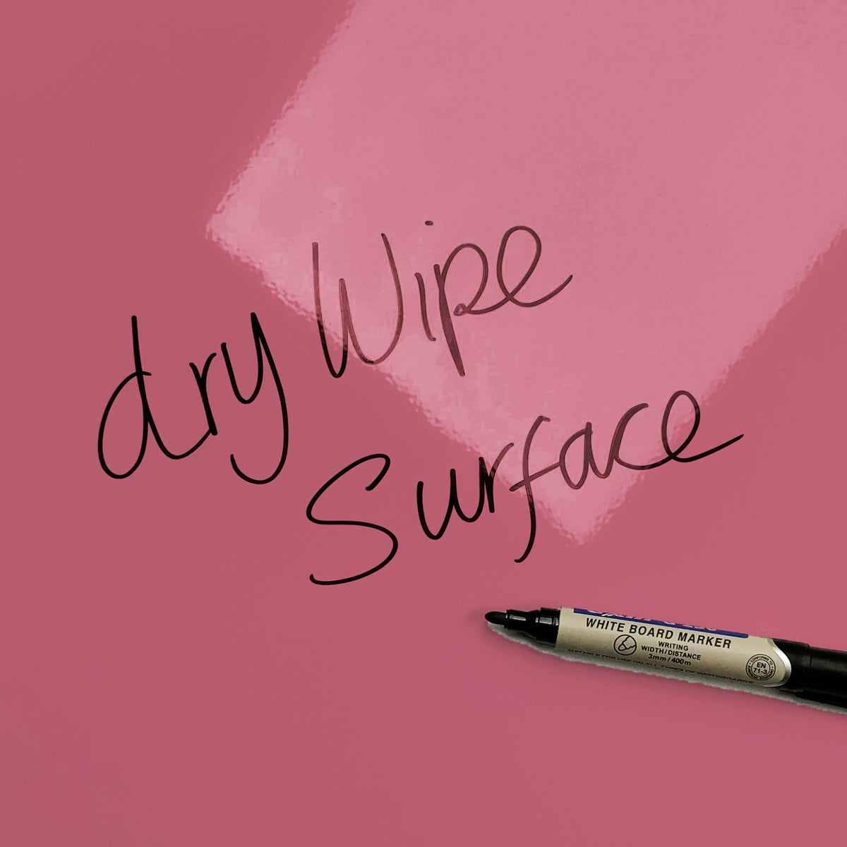 The words dry wipe surface written in marker pen on the Pink and Green Cool Britannia magnetic notice board