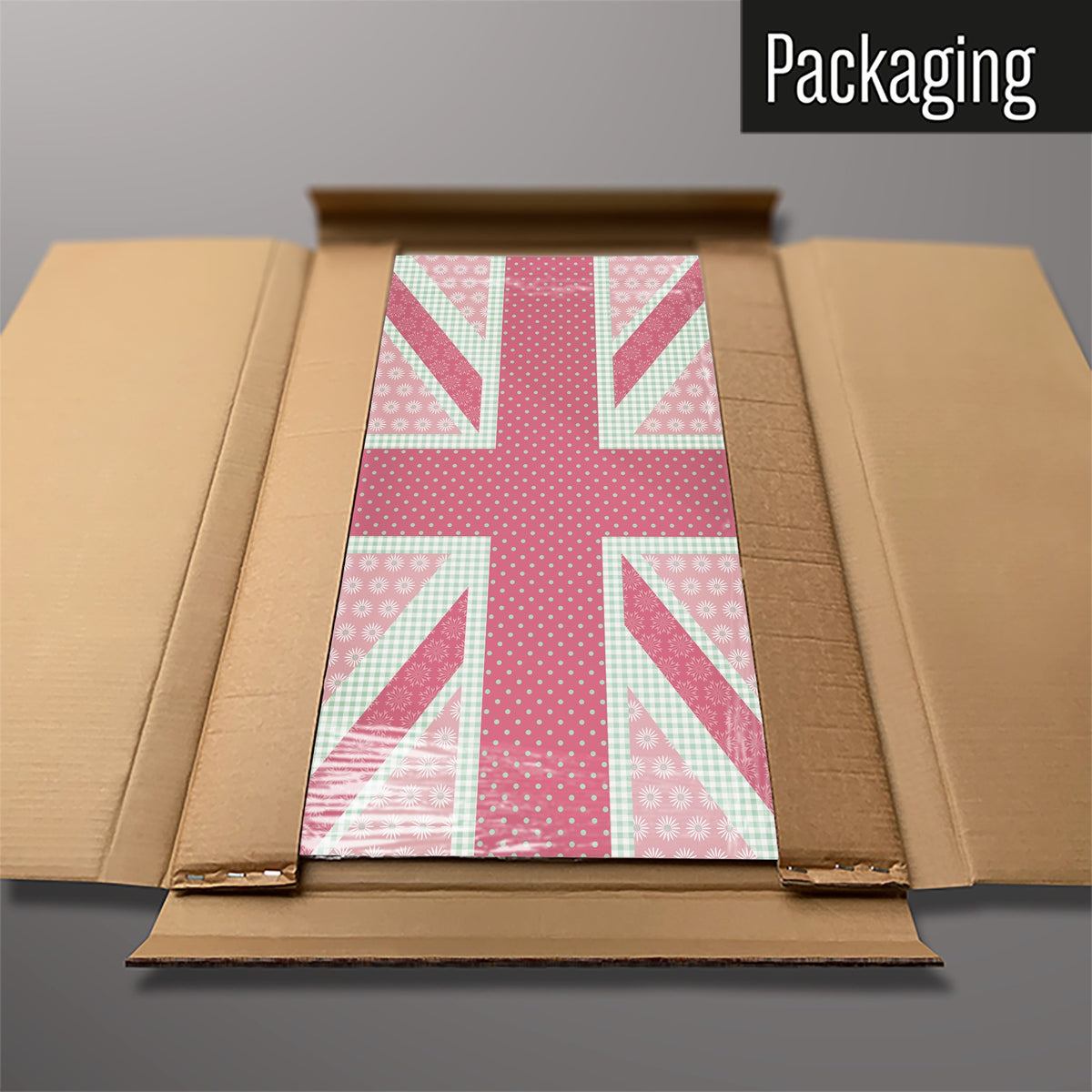 The Cool Britannia magnetic notice board in Pink and Green packed flat in its cardboard box