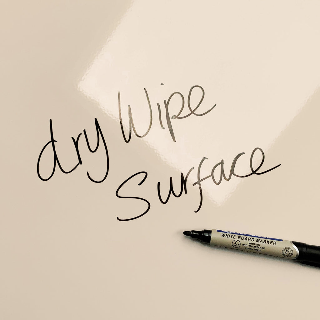 The words dry wipe surface written in marker pen on the Crytilla magnetic notice board