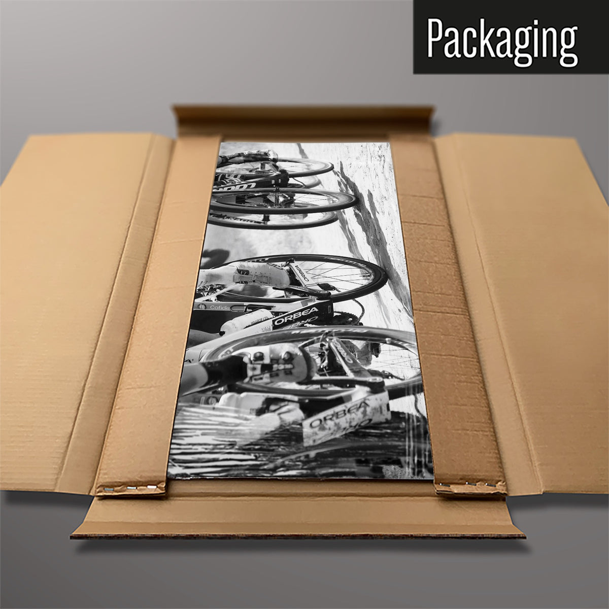 The Cyclists magnetic notice board packed flat in its cardboard box