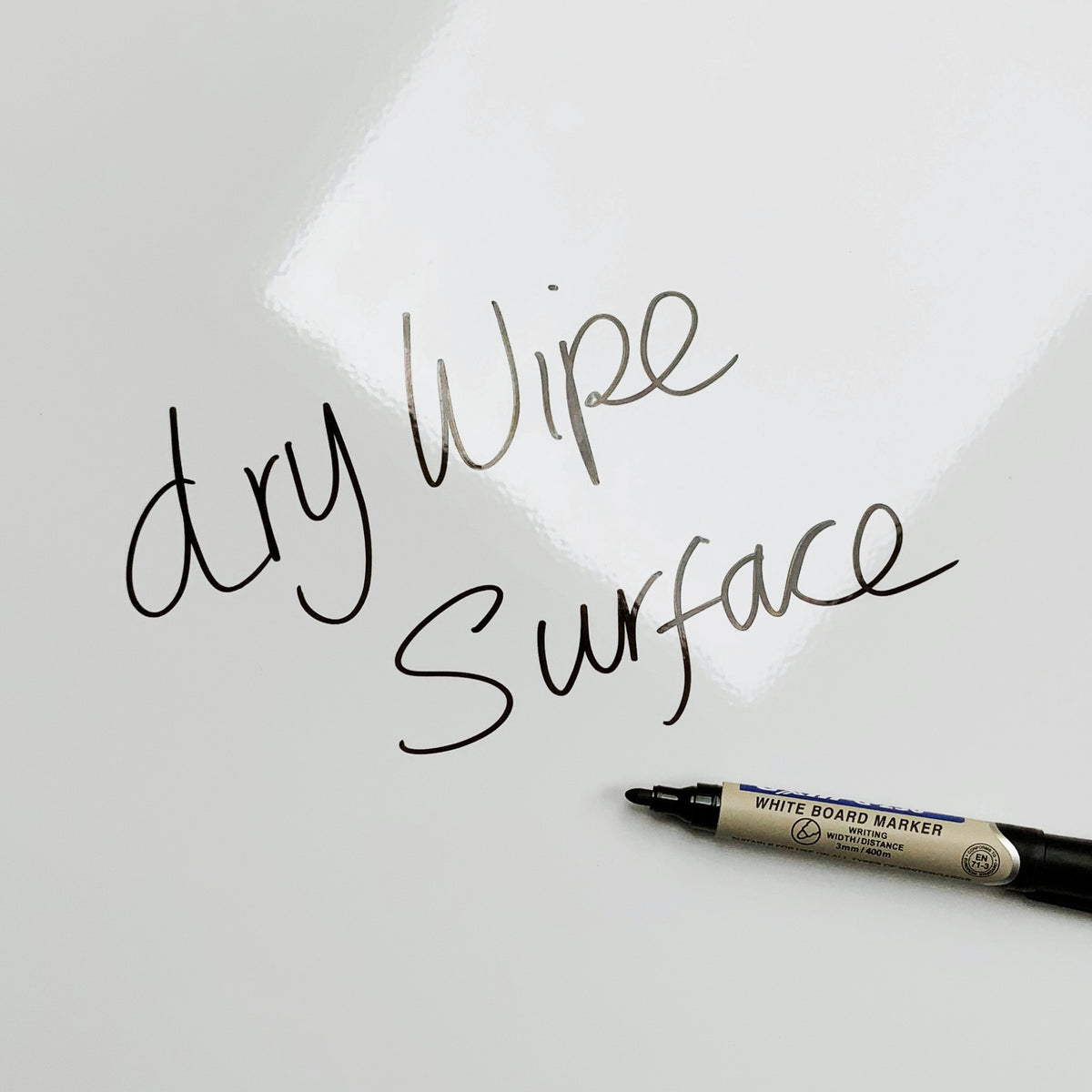 The words dry wipe surface written in marker pen on the Daisies Daisies magnetic notice board