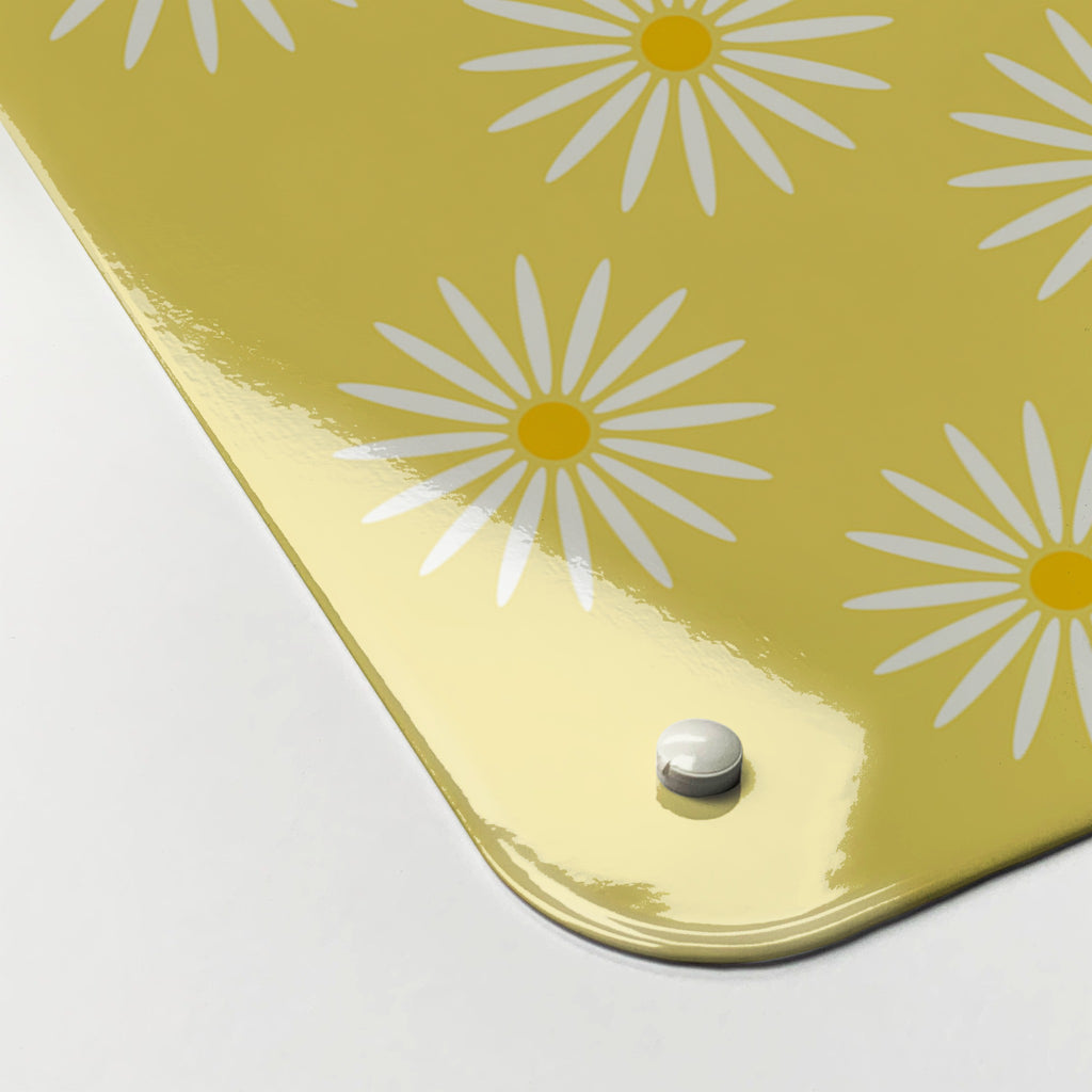 Close-up of the corner of the Daisy The Cow magnetic notice board in Blue/Yellow, showing the gloss finish and a screw cap
