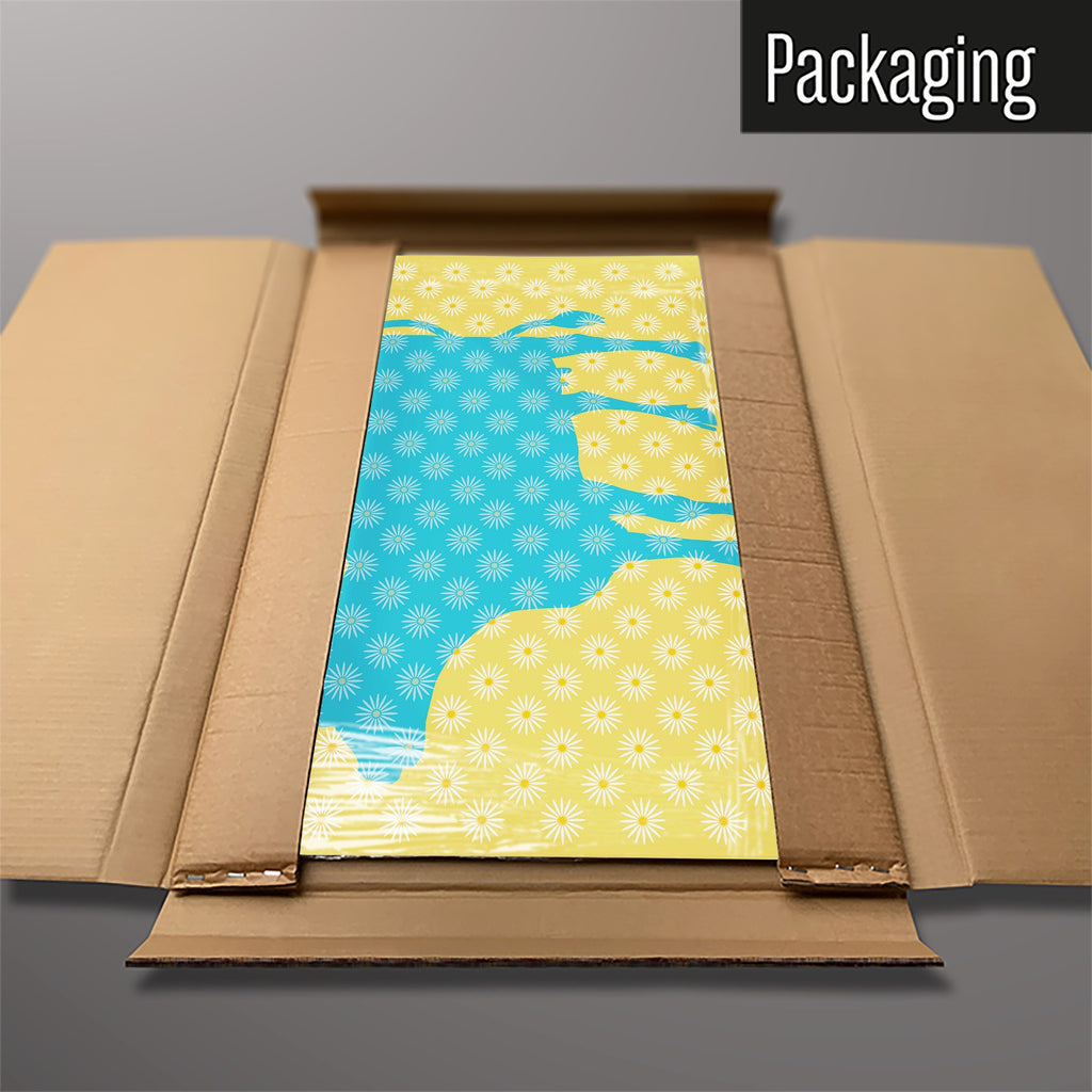 The Daisy The Cow magnetic notice board in Blue/Yellow packed flat in its cardboard box