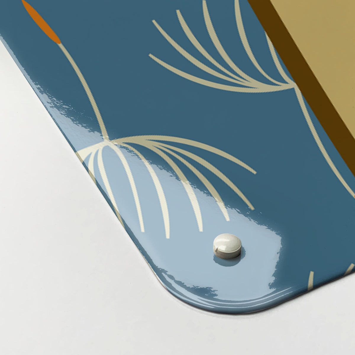 Close-up of the corner of the Dandy Lion magnetic notice board, showing the gloss finish and a screw cap