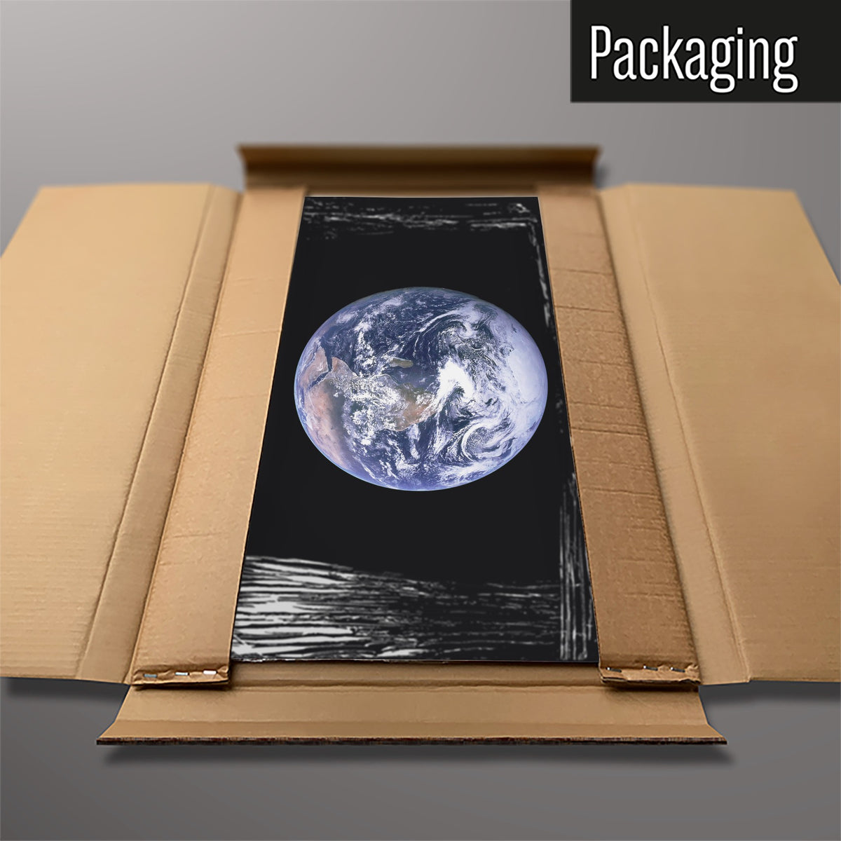 The Earth From Space magnetic notice board packed flat in its cardboard box