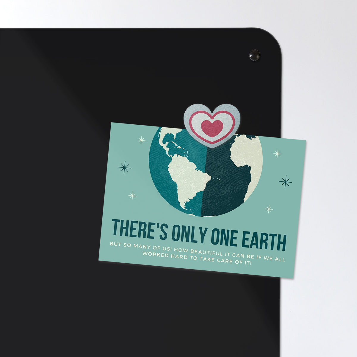 A postcard held by a fridge magnet on the Earth From Space magnetic notice board