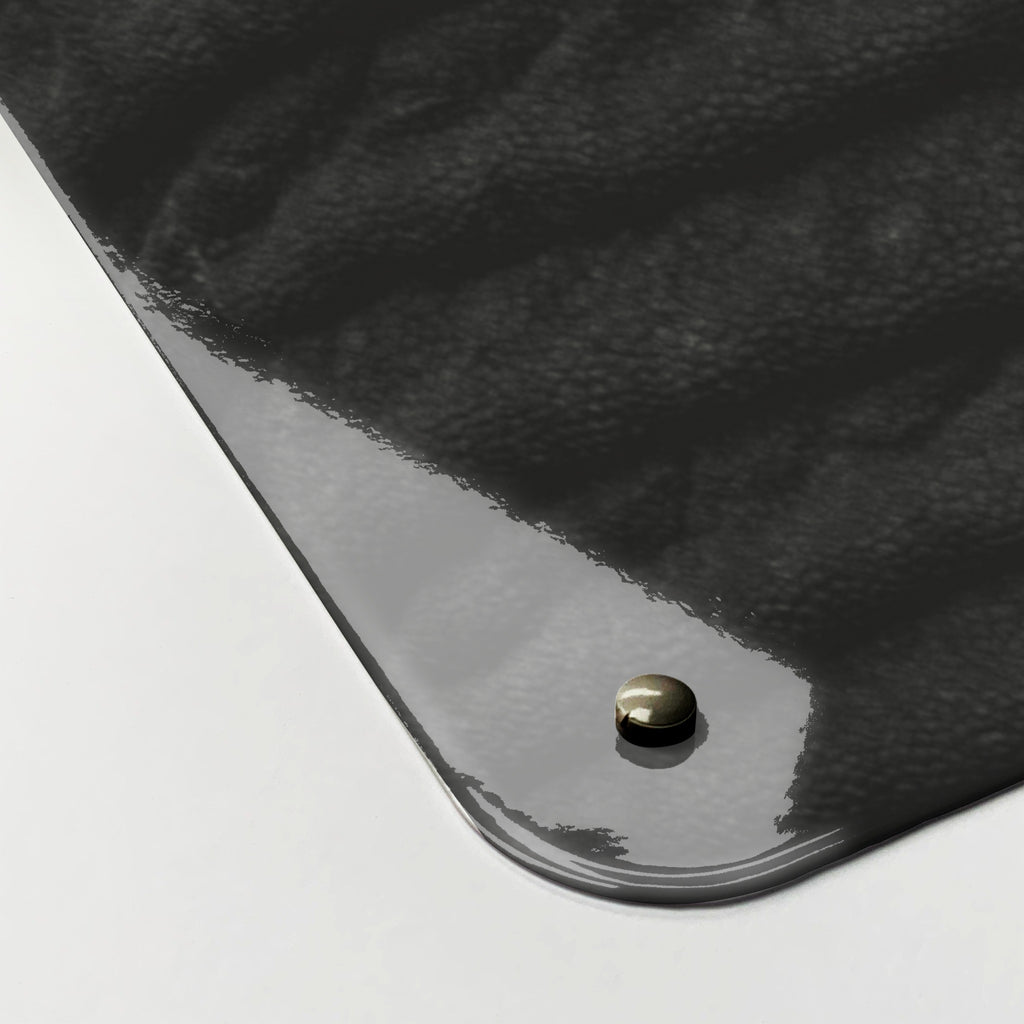Close-up of the corner of the Elephant magnetic notice board, showing the gloss finish and a screw cap