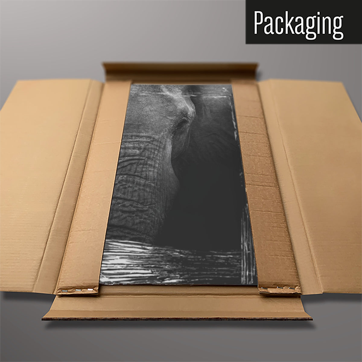 The Elephant magnetic notice board packed flat in its cardboard box