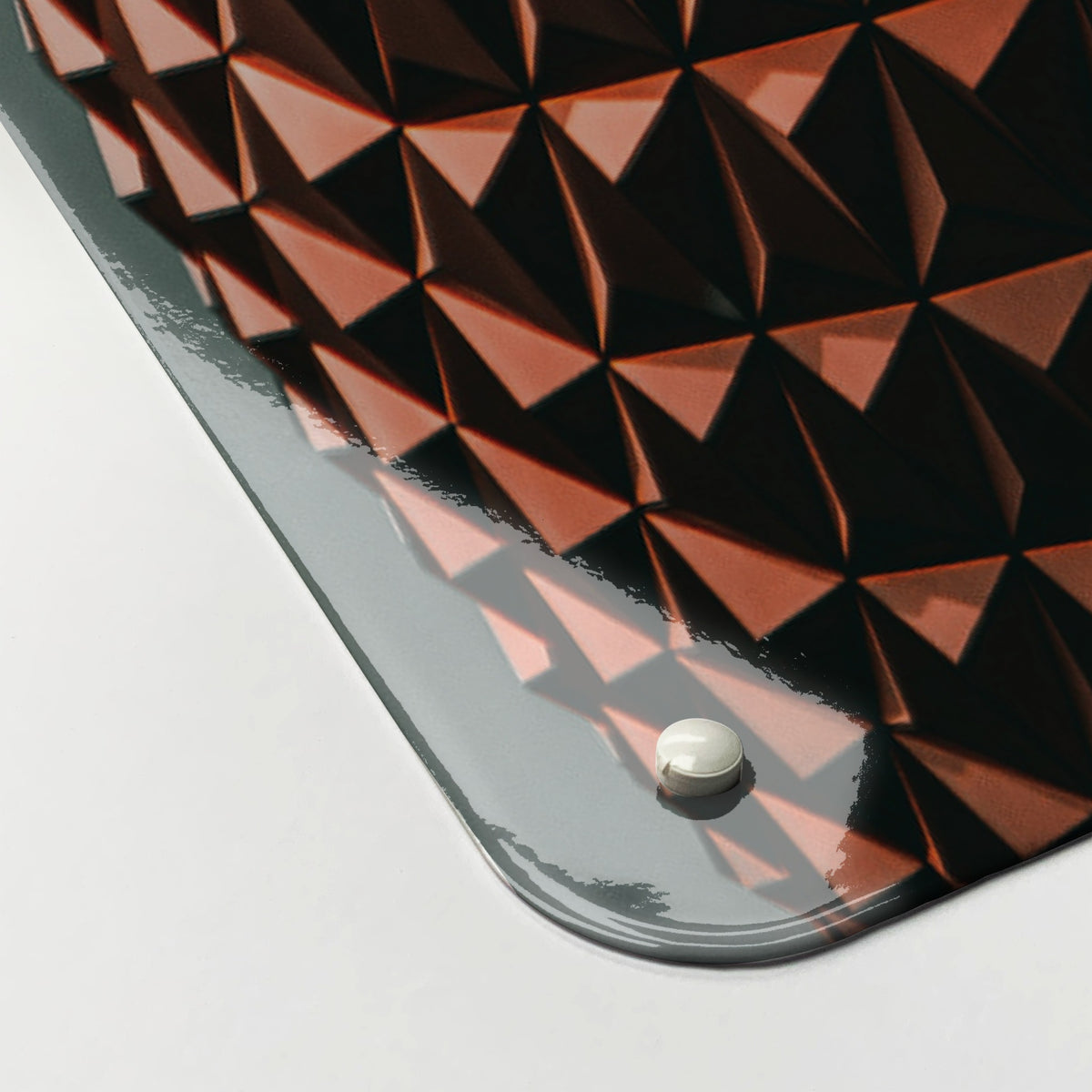 Close-up of the corner of the Epcot Center magnetic notice board, showing the gloss finish and a screw cap