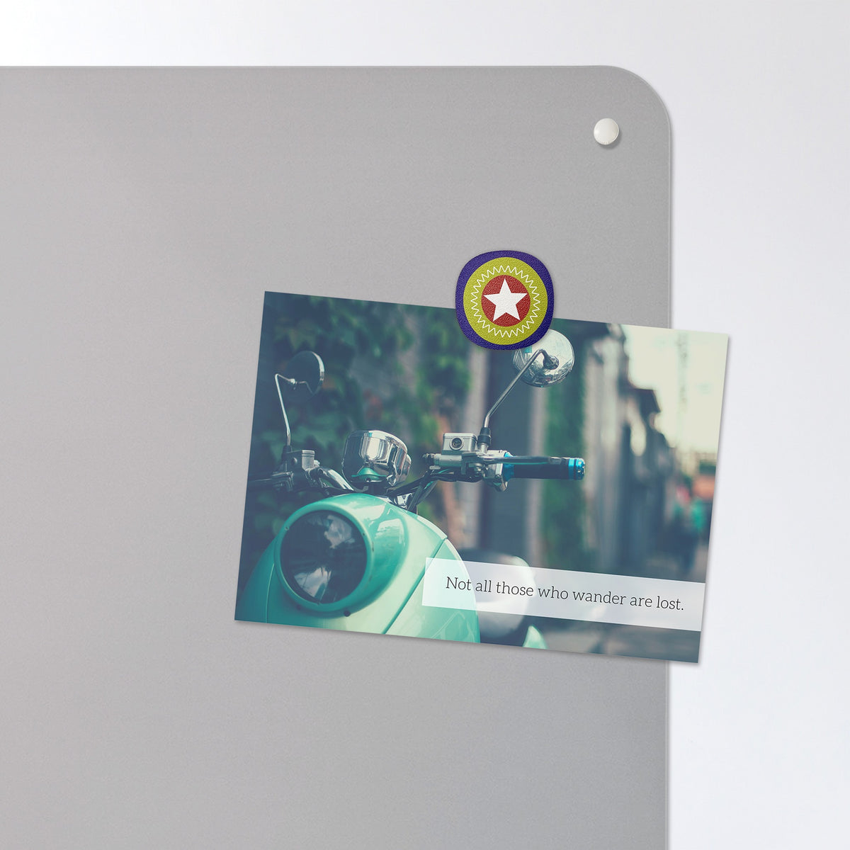 A postcard held by a fridge magnet on the Epcot Center magnetic notice board