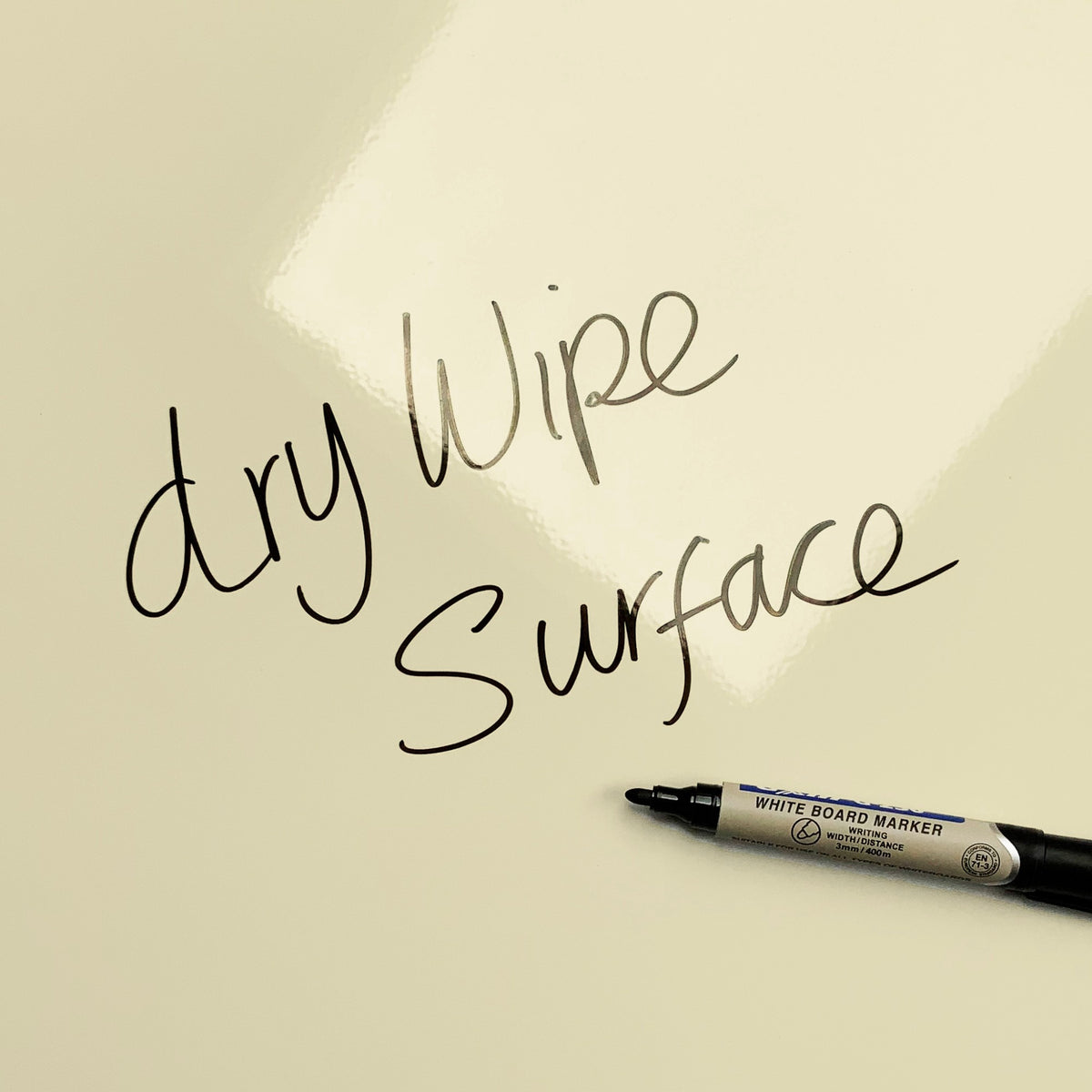 The words dry wipe surface written in marker pen on the Olive/Coral Fair Isle Owl magnetic notice board