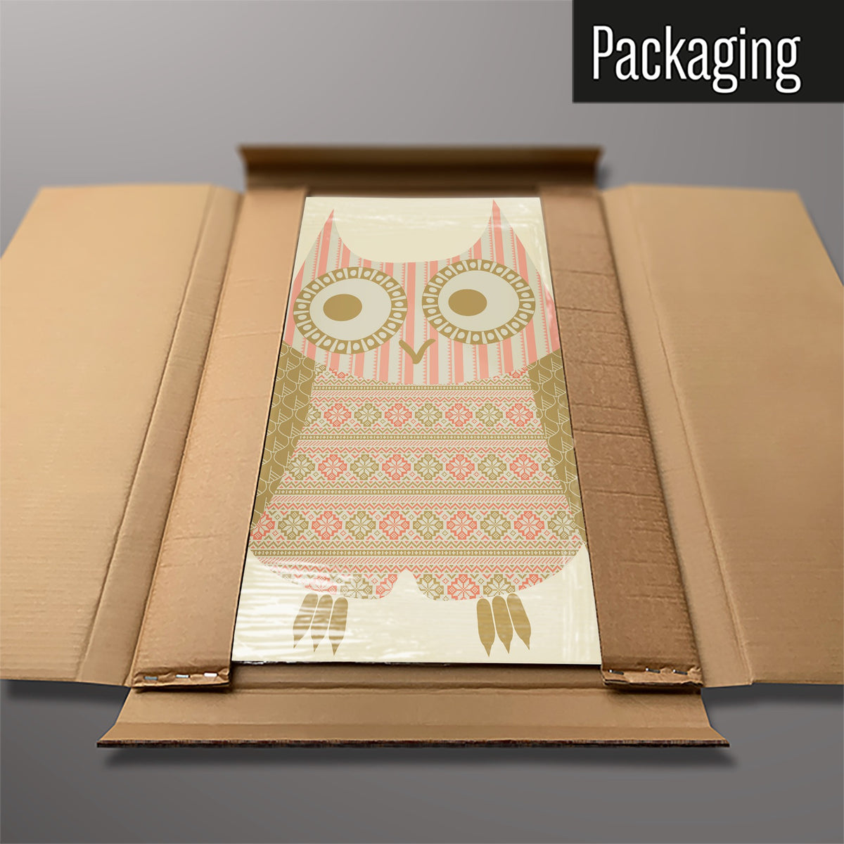 The Fair Isle Owl magnetic notice board in Olive/Coral packed flat in its cardboard box