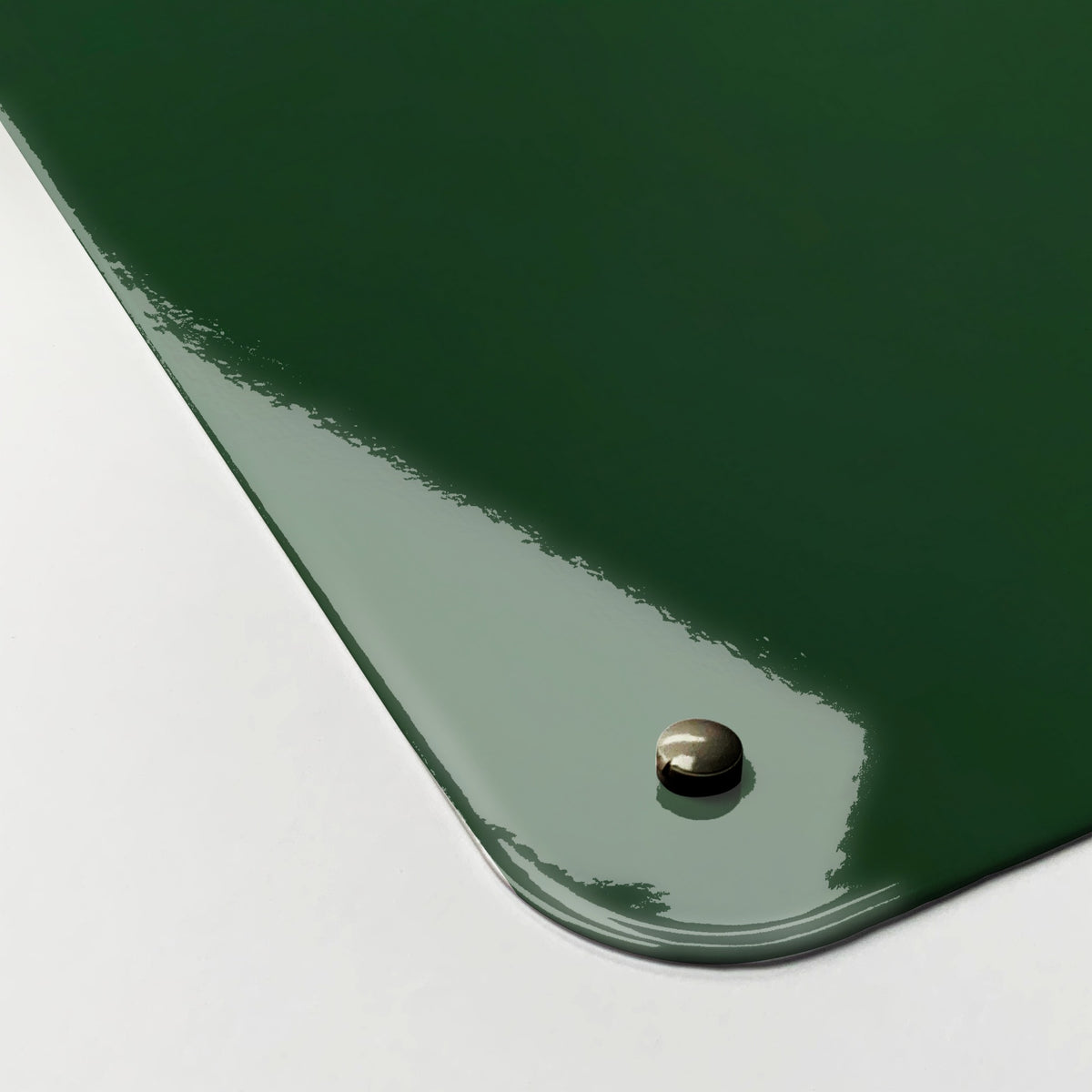 Close-up of the corner of the Fern magnetic notice board, showing the gloss finish and a screw cap
