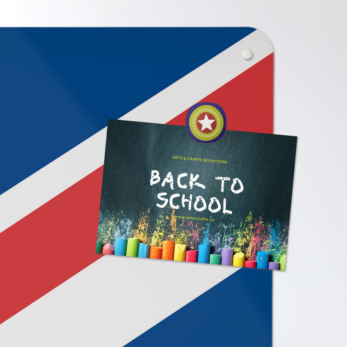 A postcard held by a fridge magnet on the Flags magnetic notice board in Union Jack