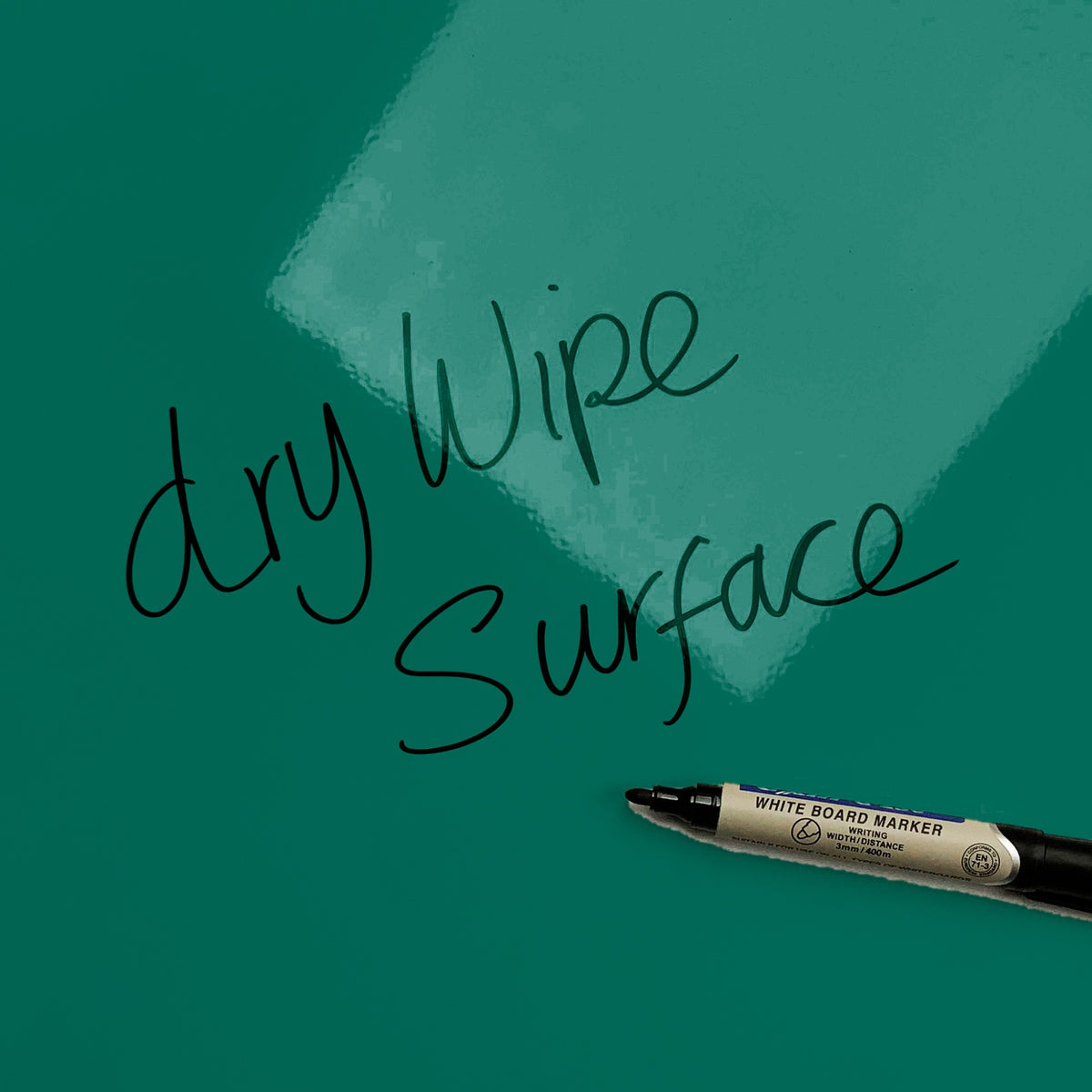 The words dry wipe surface written in marker pen on the Forest Floor magnetic notice board