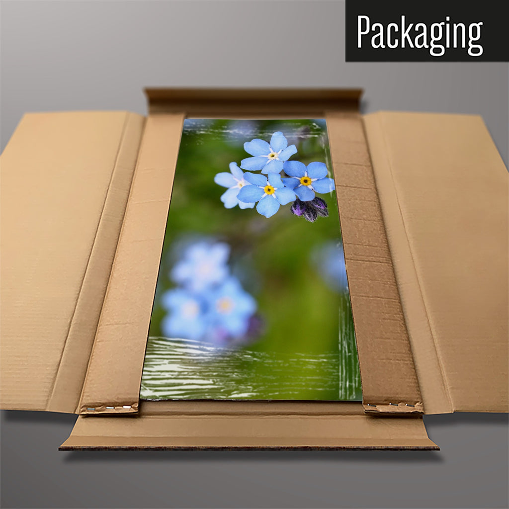 The Forget Me Not magnetic notice board packed flat in its cardboard box
