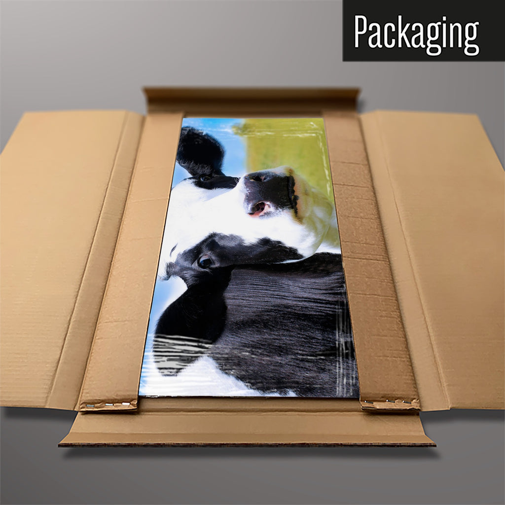 The Friesian Cow magnetic notice board packed flat in its cardboard box