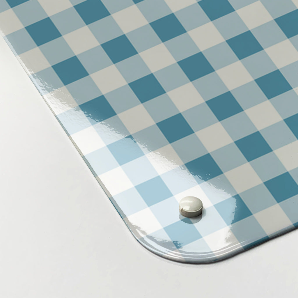 Close-up of the corner of the Gingham magnetic notice board in Blue, showing the gloss finish and a screw cap