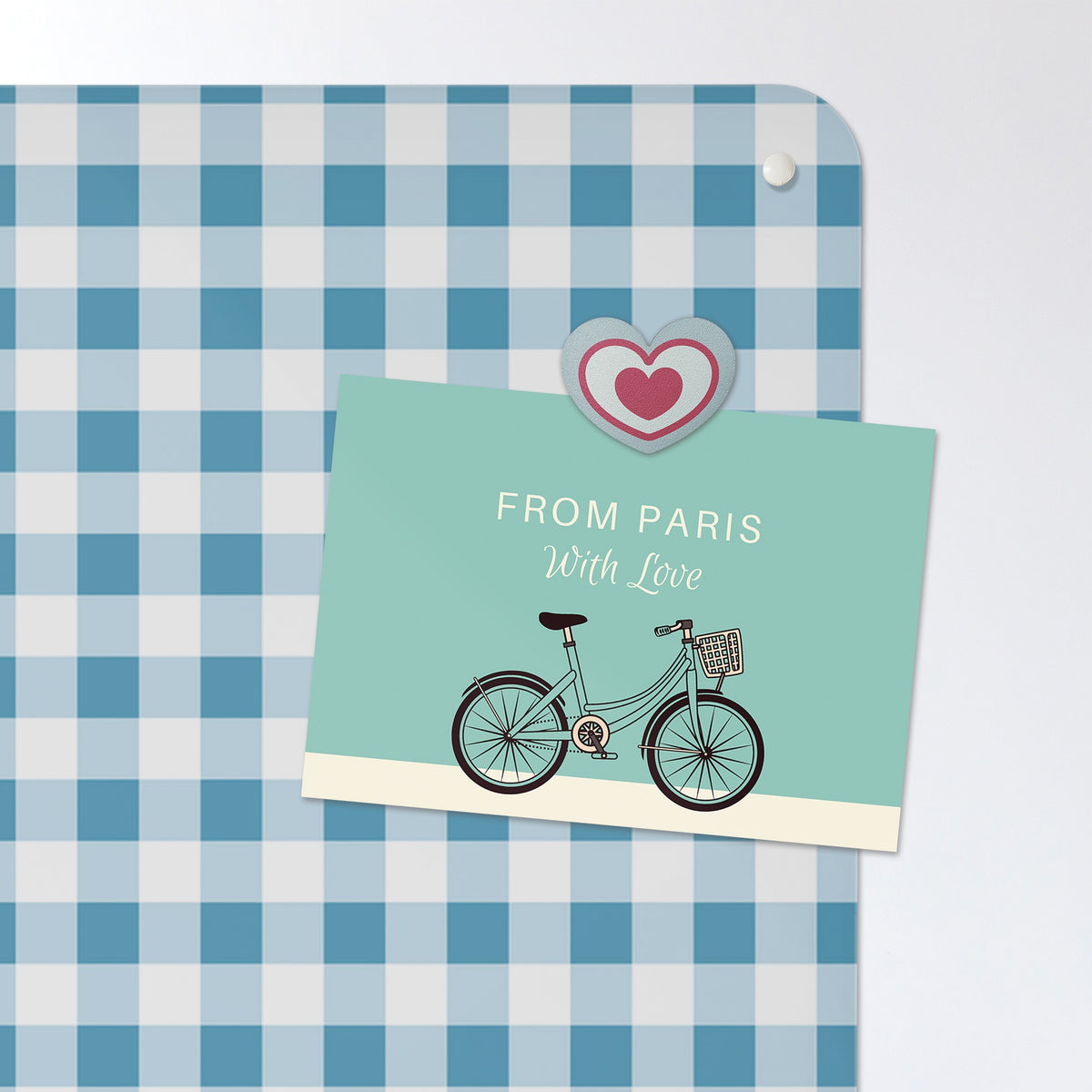 A postcard held by a fridge magnet on the Gingham magnetic notice board in Blue
