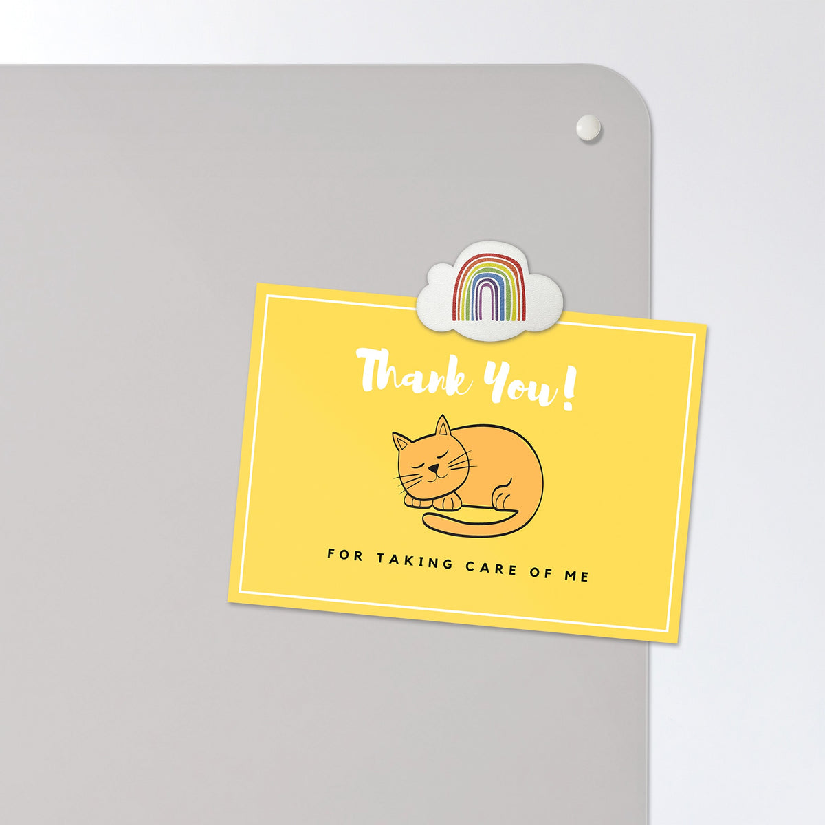 A postcard held by a fridge magnet on the Golden Retriever Puppy magnetic notice board