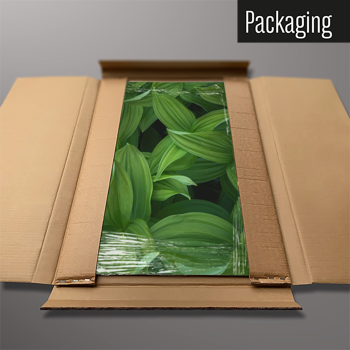 The Green Leaves magnetic notice board packed flat in its cardboard box