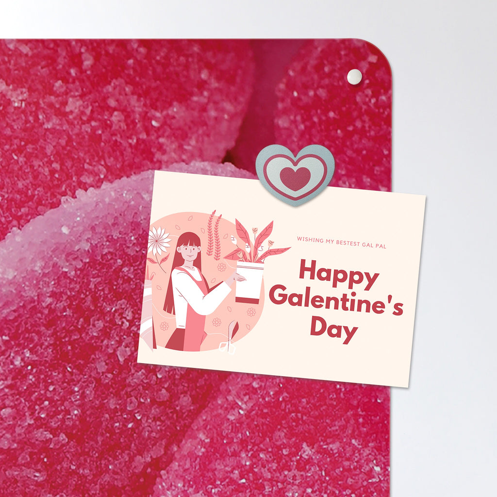 A postcard held by a fridge magnet on the Heart Sweets magnetic notice board in Heart Sweets