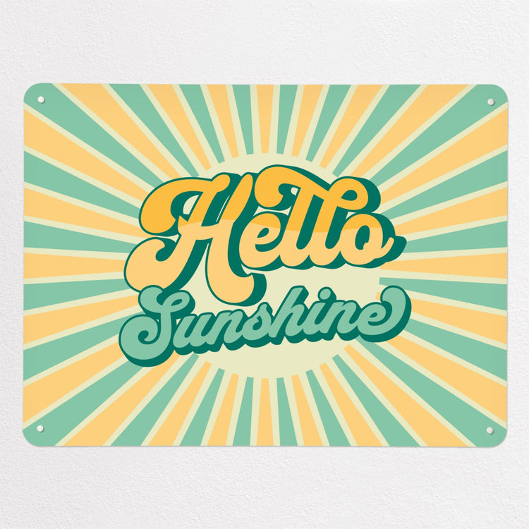 A large steel magnetic board with a print of a typographic quote design that reads Hello Sunshine with a sunburst in aqua and yellow colours