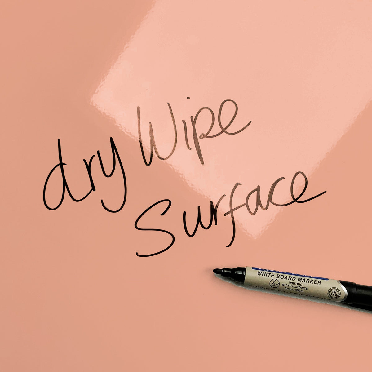 The words dry wipe surface written in marker pen on the Pink and Orange Hello Sunshine Quote magnetic notice board