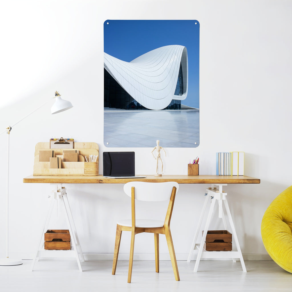 Heydar Aliyev Centre magnetic notice board above a desk in a home office