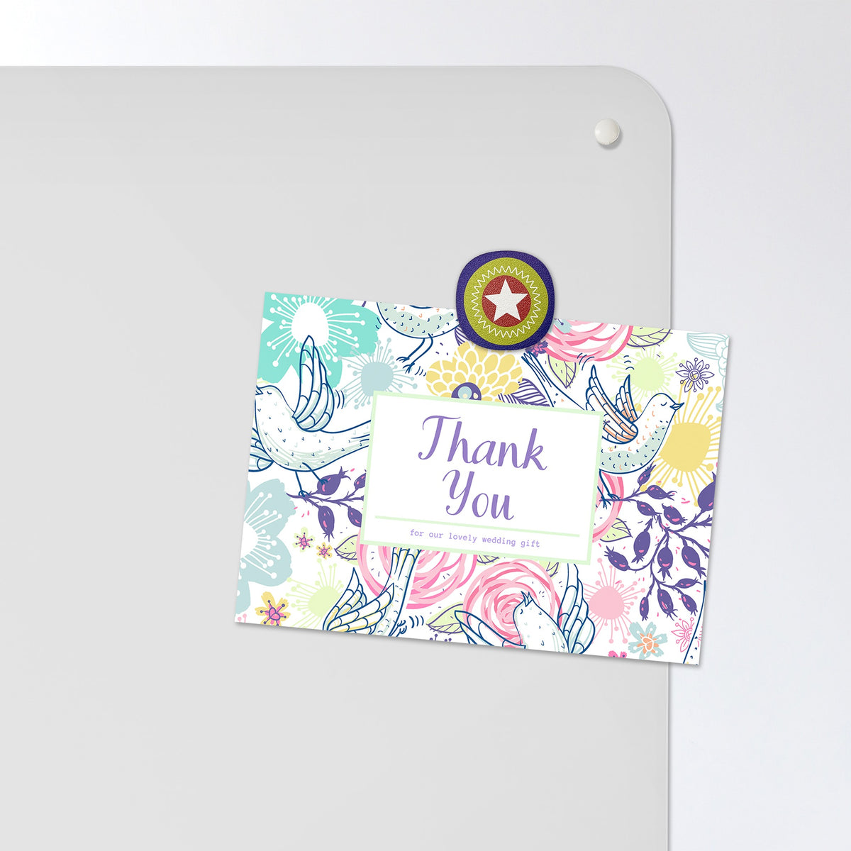 A postcard held by a fridge magnet on the Inspirational Quote Albert Einstein magnetic notice board in White