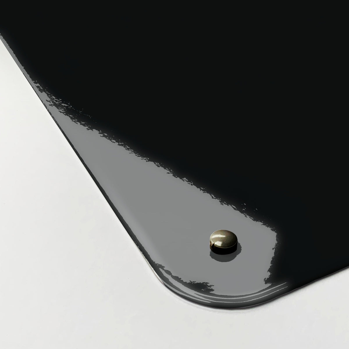 Close-up of the corner of the Inspirational Quote Pablo Picasso magnetic notice board in Dark Blue, showing the gloss finish and a screw cap