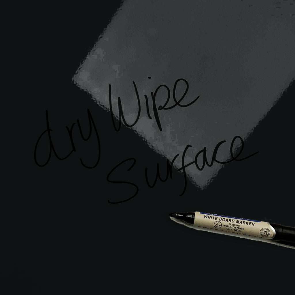 The words dry wipe surface written in marker pen on the Dark Blue Inspirational Quote Pablo Picasso magnetic notice board