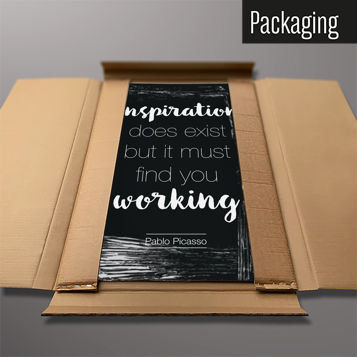 The Inspirational Quote Pablo Picasso magnetic notice board in Dark Blue packed flat in its cardboard box