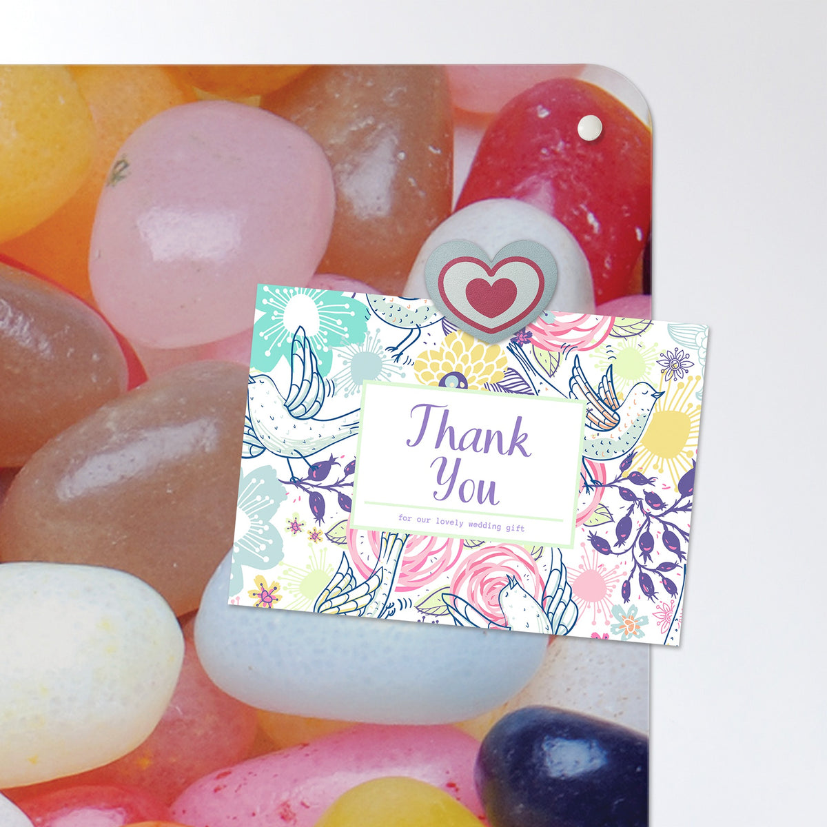 A postcard held by a fridge magnet on the Jelly Beans magnetic notice board in Jelly Beans