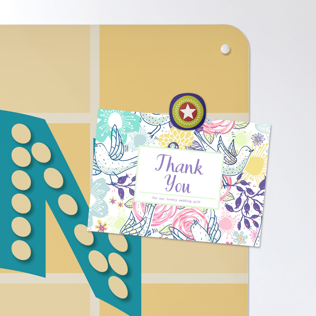 A postcard held by a fridge magnet on the Kitchen Disco magnetic notice board in Teal